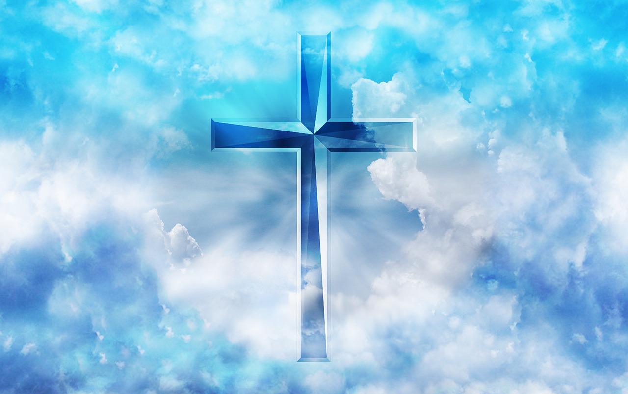 A cross surrounded by clouds